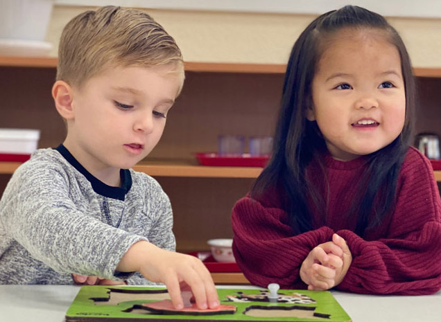 Montessori School of Tracy teacher working with two-year old toddler program